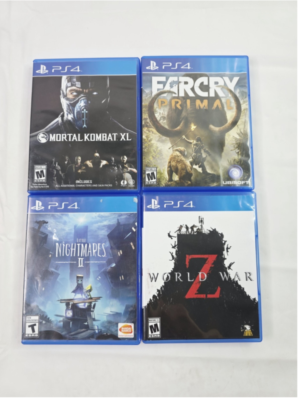 Lot Of 4 PS4 Games Farcry Primal, Mortal Combat XL, World War Z